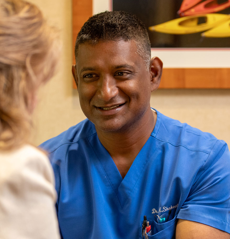 Dr. Shakeel smiling at patient